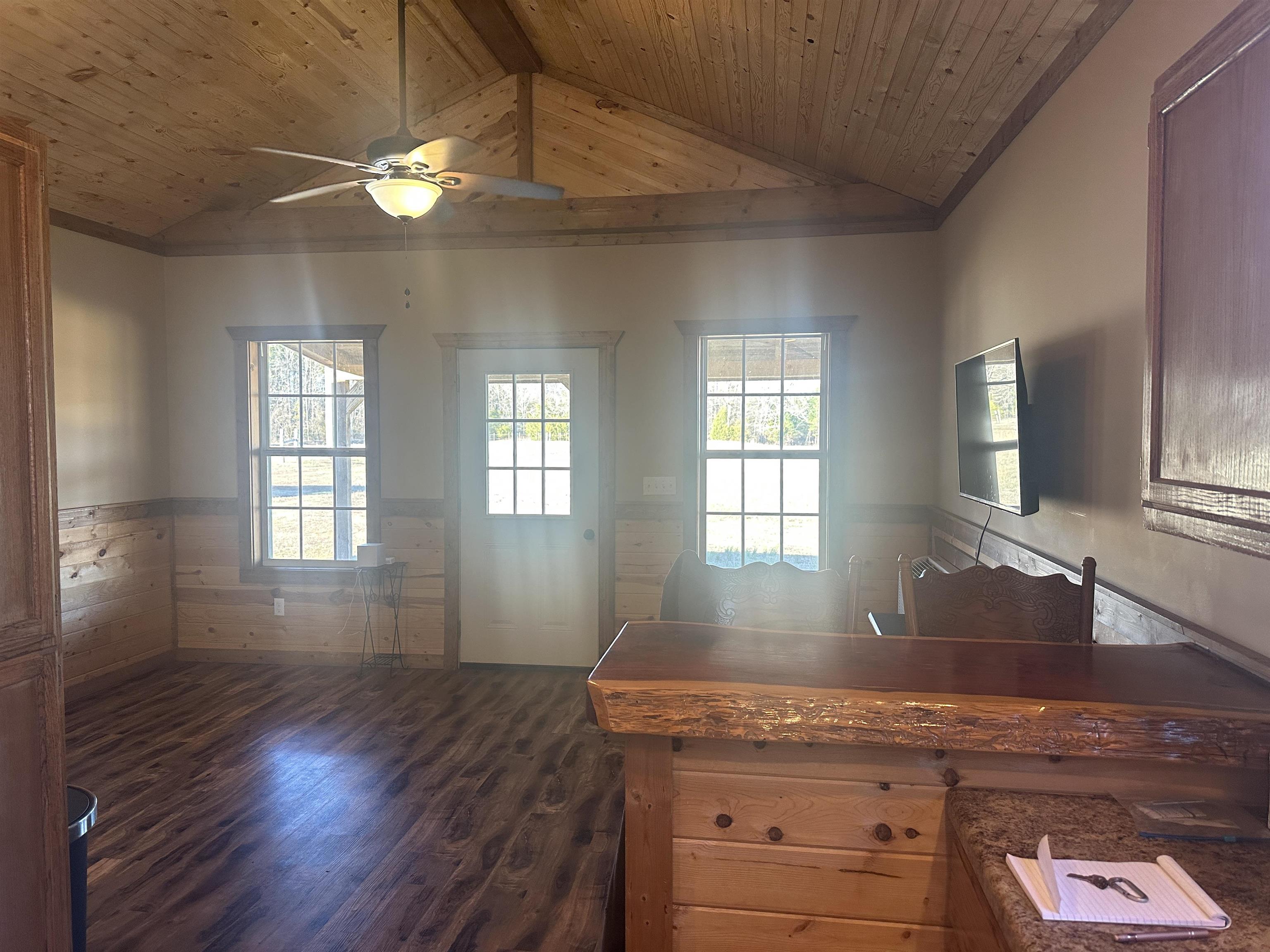 2245 Fritton Spur Road Middleton, TN 38052 - Photo 16 of 24 Kitchen with a wainscoted wall, plenty of natural light, wood ceiling, a ceiling fan, and dark wood-type flooring