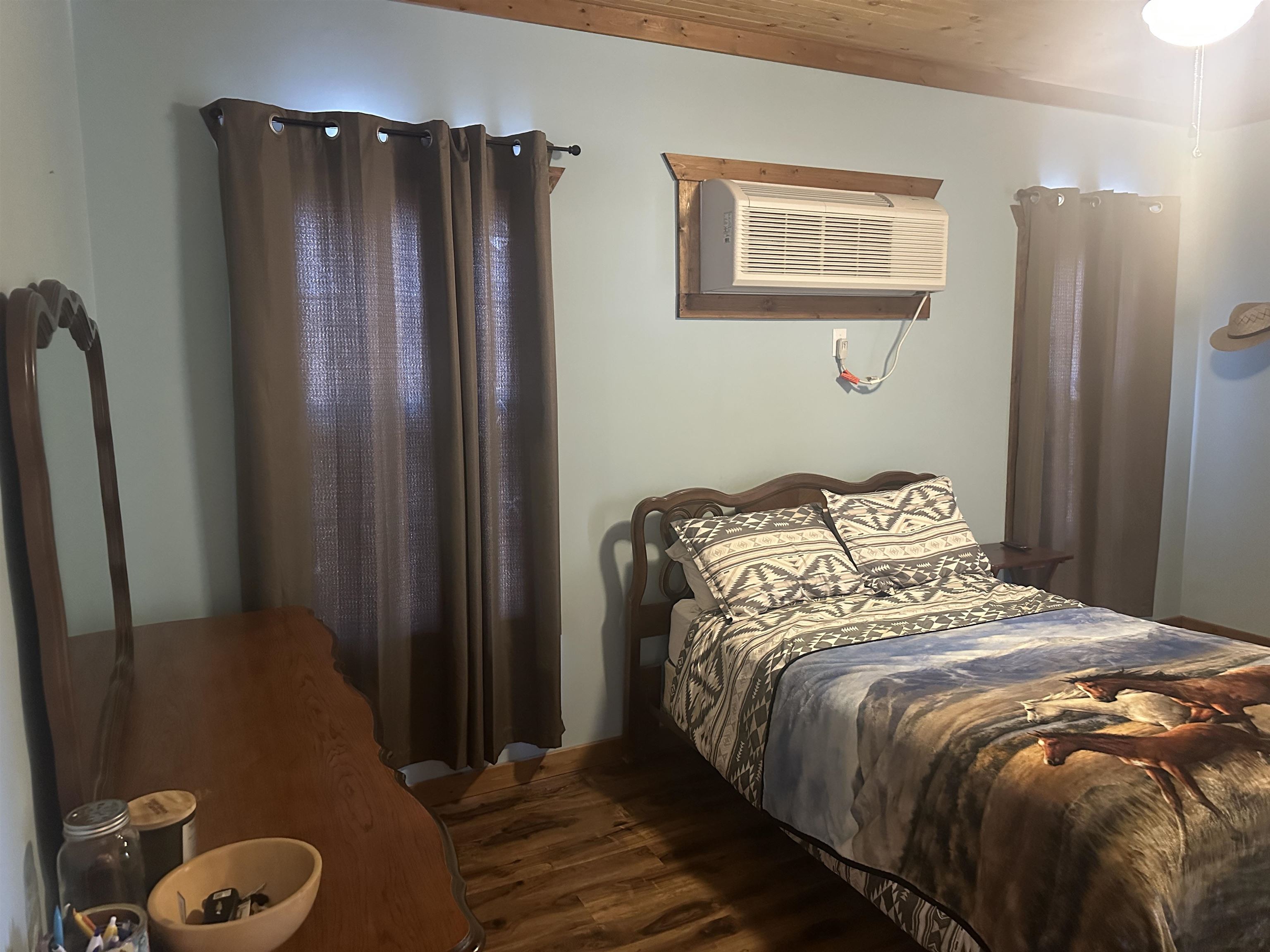 2245 Fritton Spur Road Middleton, TN 38052 - Photo 18 of 24 Bedroom featuring wood finished floors and a wall mounted air conditioner