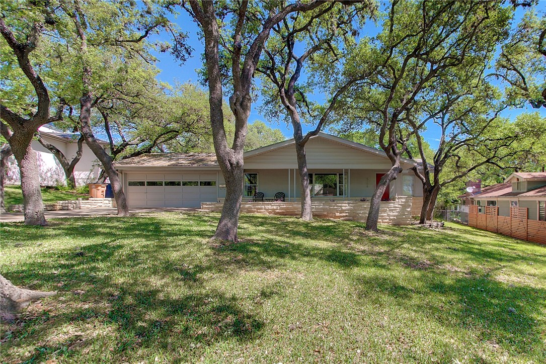 5108 Crestway Drive Austin, TX 78731 - Photo 1 of 1 a backyard of a house with table and chairs