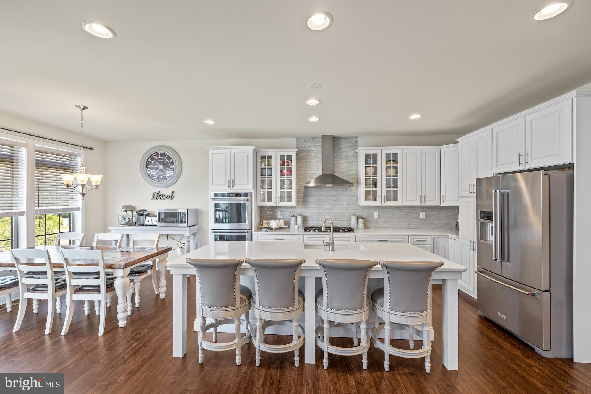 9 Lookout Court Gettysburg, PA 17325 - Photo 7 of 86 a kitchen with stainless steel appliances a dining table chairs refrigerator and cabinets