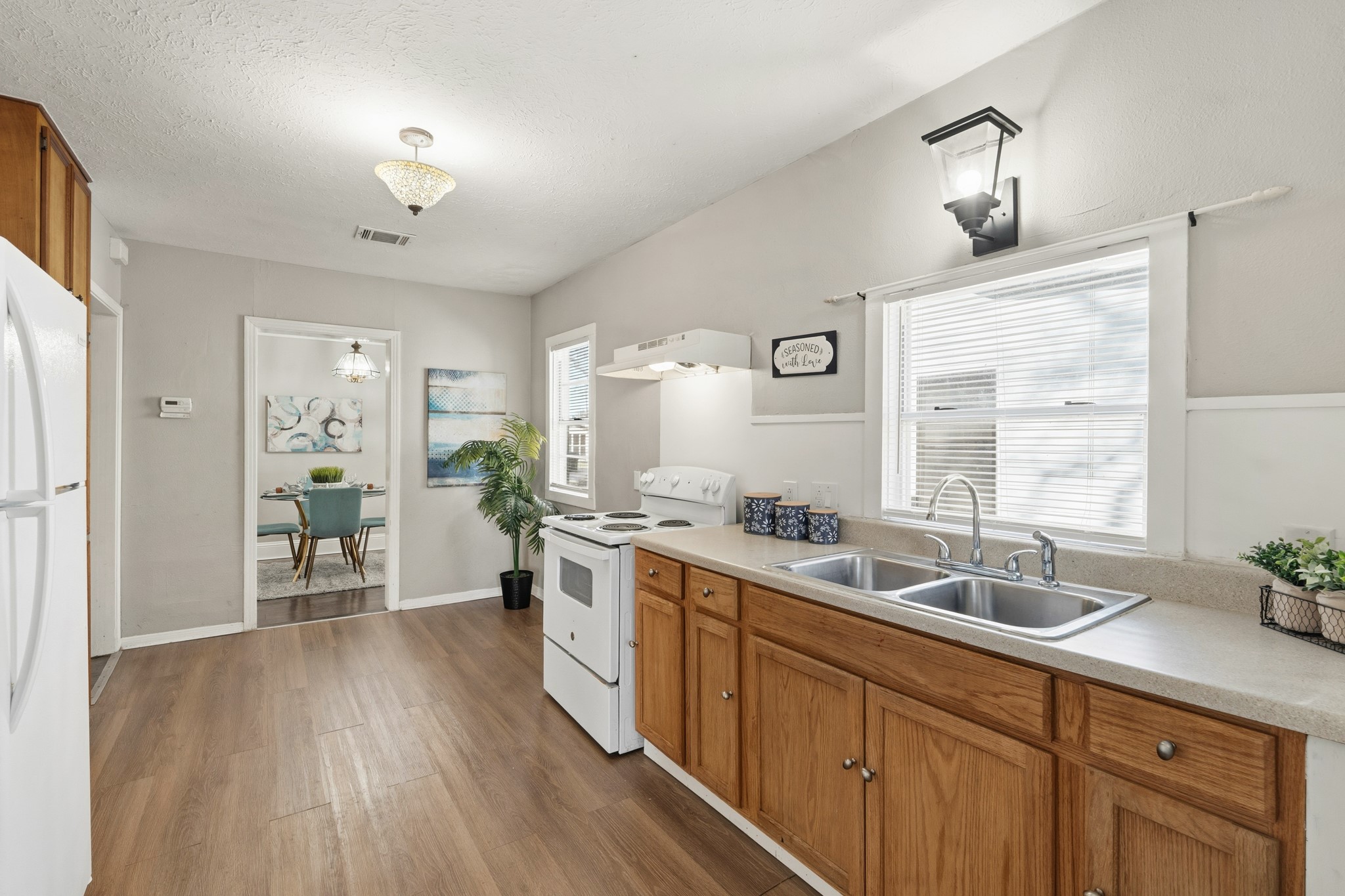 1509 Mulcahy Street Rosenberg, TX 77471 - Photo 14 of 41 a large white kitchen with a large window