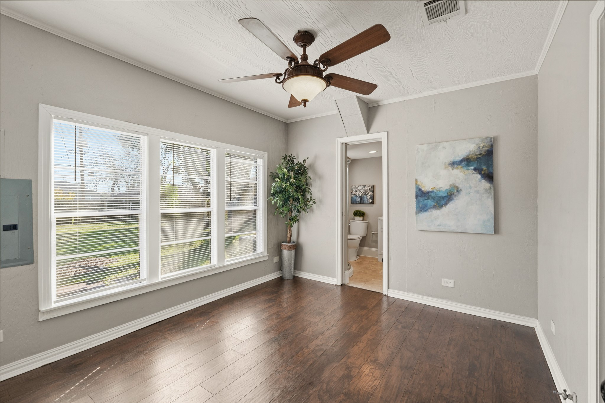 1509 Mulcahy Street Rosenberg, TX 77471 - Photo 15 of 41 a view of an empty room with a window and wooden floor