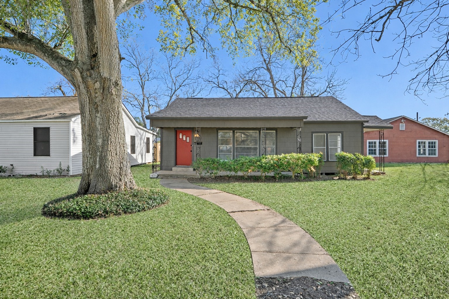 1509 Mulcahy Street Rosenberg, TX 77471 - Photo 1 of 41 a front view of a house with a garden