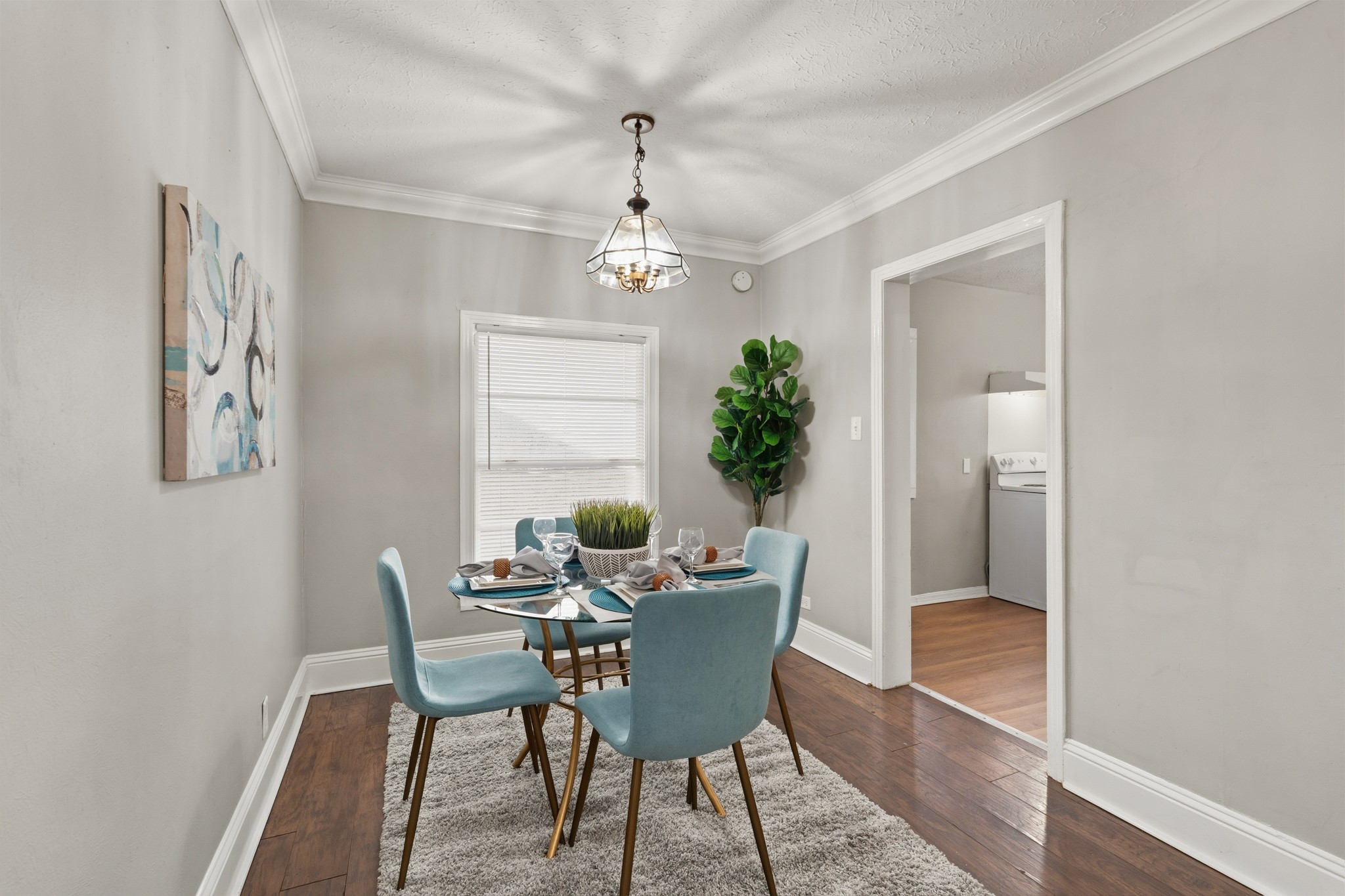 1509 Mulcahy Street Rosenberg, TX 77471 - Photo 9 of 41 a dining room with furniture a chandelier and wooden floor