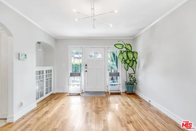 a view of an entryway with wooden floor