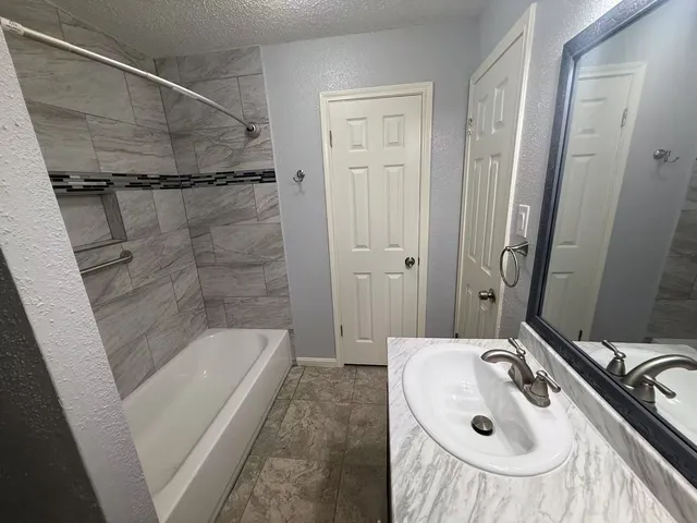 a bathroom with a sink and a tub