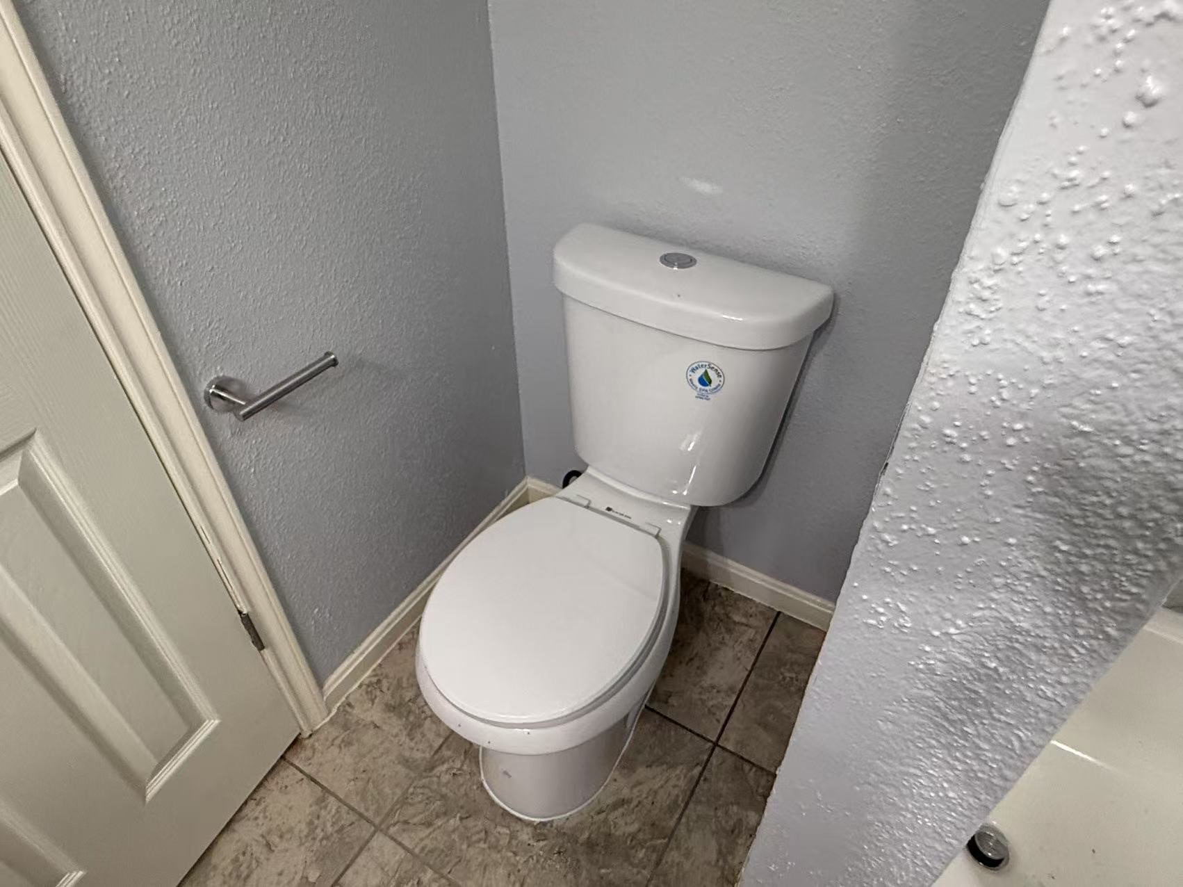 5719 Lycomb Drive Houston, TX 77053 - Photo 16 of 24 a white toilet sitting next to a sink