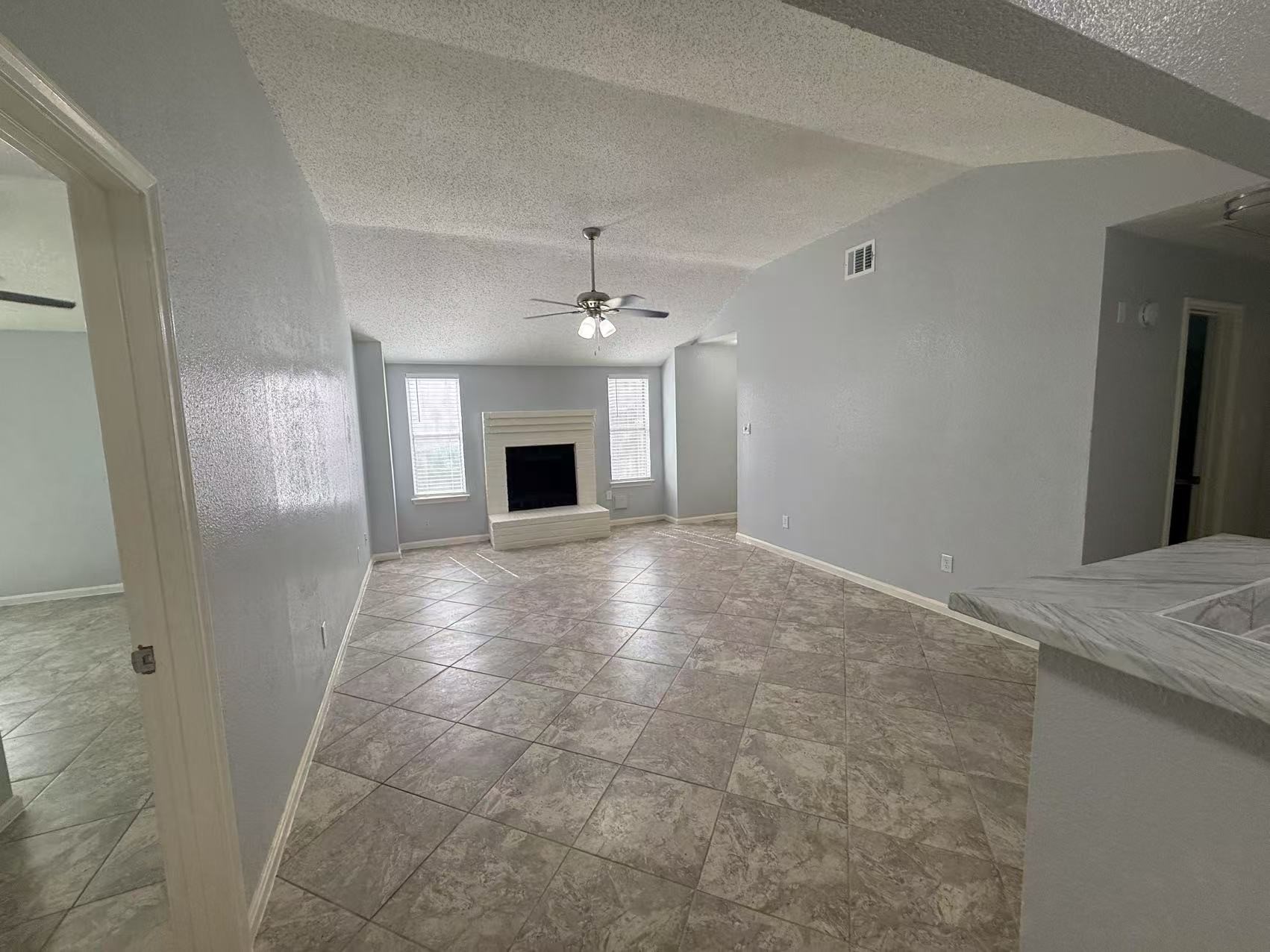 5719 Lycomb Drive Houston, TX 77053 - Photo 4 of 24 a view of an empty room with a fireplace