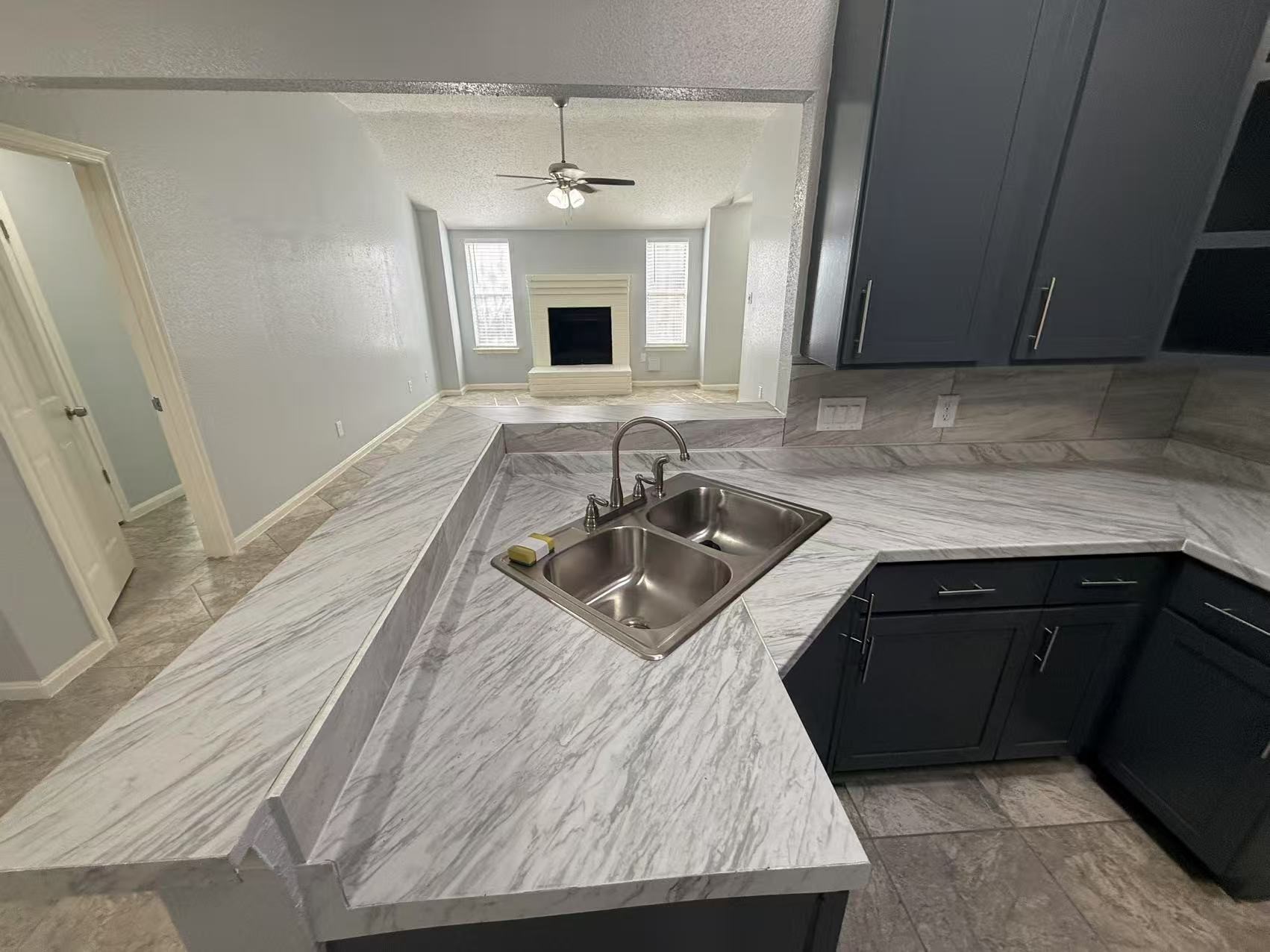 5719 Lycomb Drive Houston, TX 77053 - Photo 6 of 24 a kitchen with stainless steel appliances granite countertop a sink dishwasher stove and refrigerator