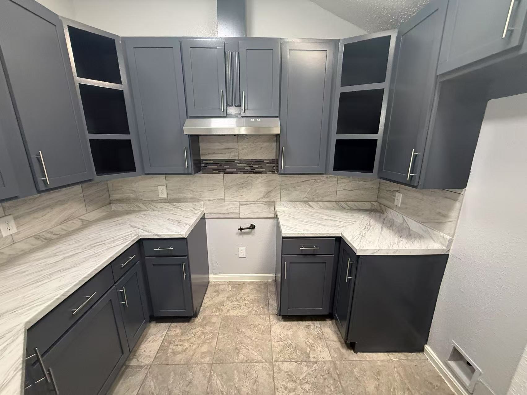 5719 Lycomb Drive Houston, TX 77053 - Photo 7 of 24 a kitchen with stainless steel appliances granite countertop a sink stove and refrigerator