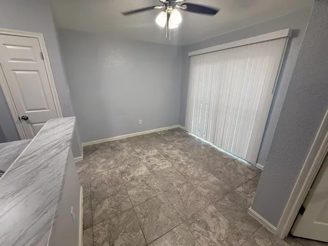 a view of livingroom with hardwood floor and ceiling fan