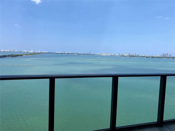 a view of a lake from a balcony