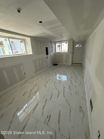 a view of an empty room and window