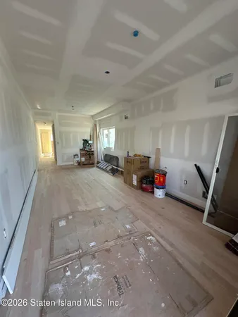 a view of a livingroom with furniture and windows