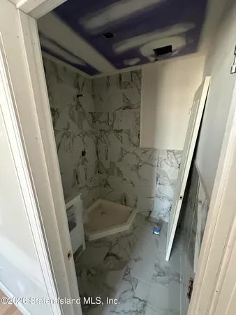 a bathroom with a sink and a shower