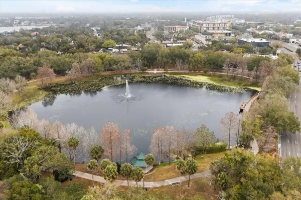 an aerial view of residential building and lake