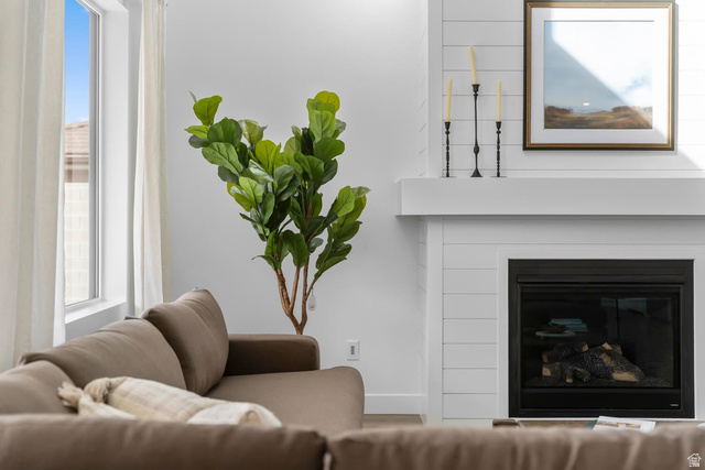 382 North Rhyolite Drive, Unit 111 Hurricane, UT 84737 - Photo 29 of 37 Living area featuring a modern fireplace with a black insert, white shiplap surround, and a substantial mantelpiece