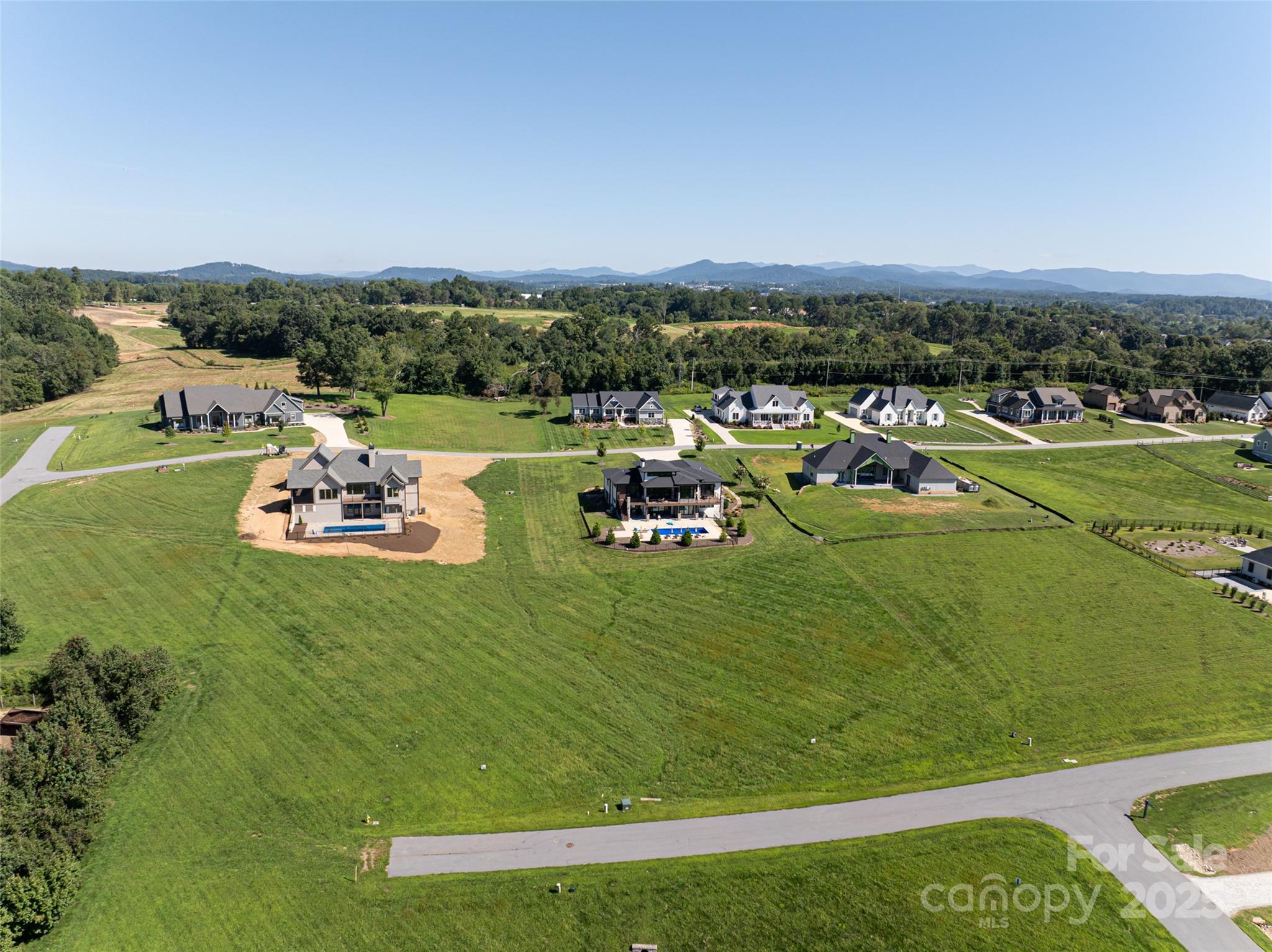 108 Double Knob Road, Unit 65 Mills River, NC 28759 - Photo 5 of 9 a front view of a lake with houses