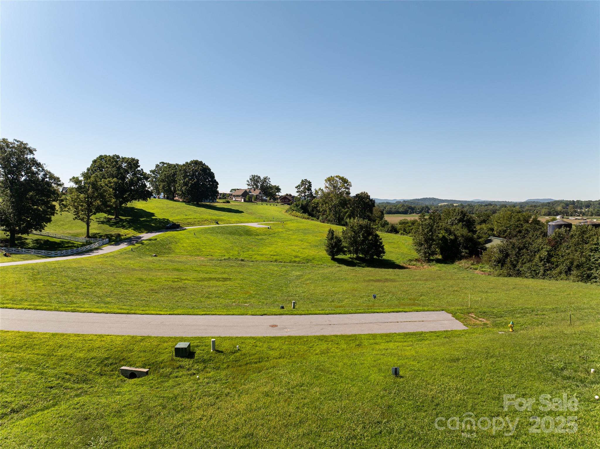 108 Double Knob Road, Unit 65 Mills River, NC 28759 - Photo 8 of 9 a view of a golf course with a lake