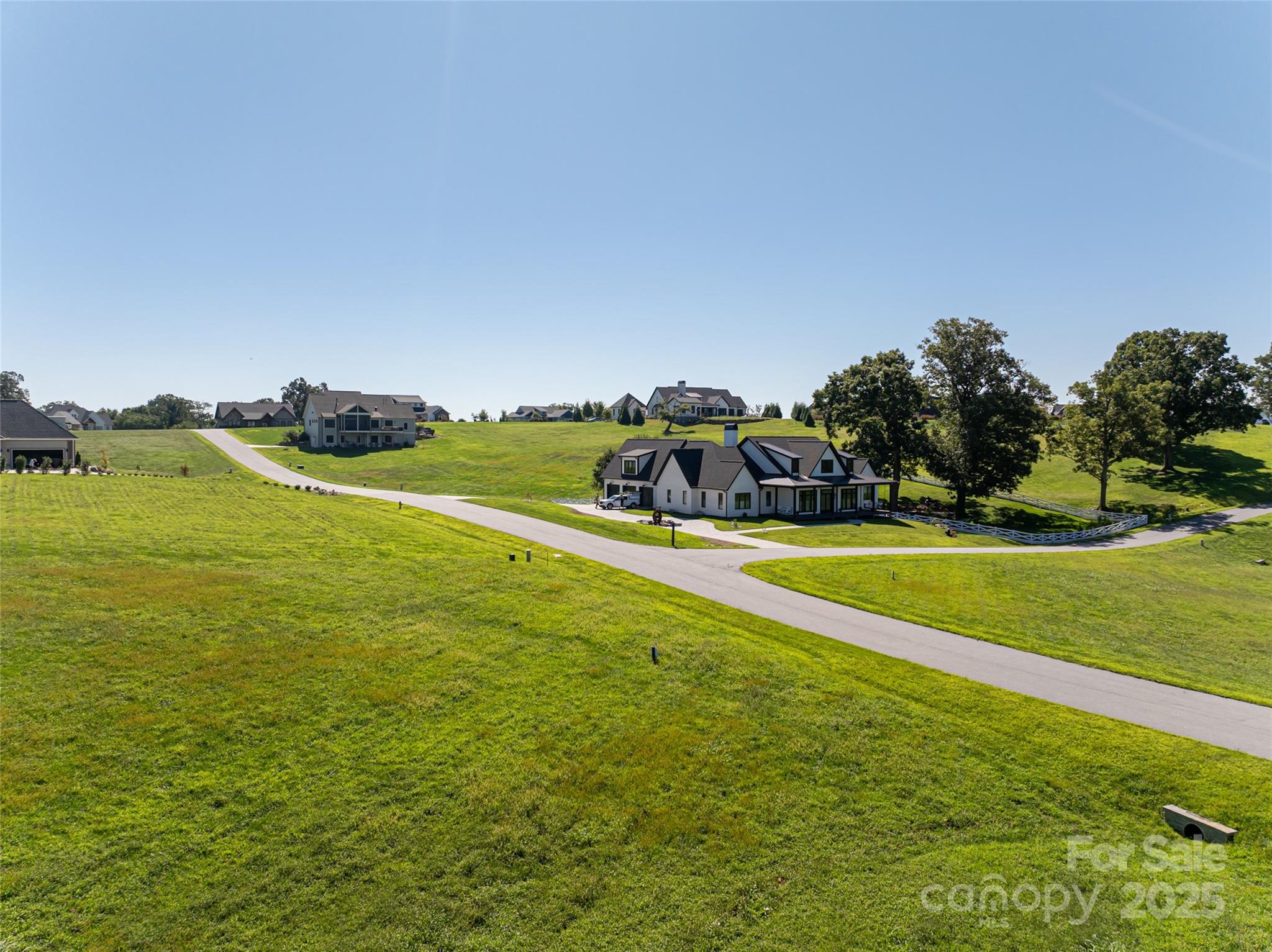 108 Double Knob Road, Unit 65 Mills River, NC 28759 - Photo 9 of 9 a view of a swimming pool with an outdoor seating and a yard