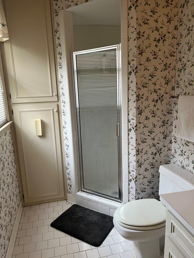 2250 15th Street, Unit 7 Columbus, GA 31906 - Photo 11 of 14 a bathroom with a toilet and a shower