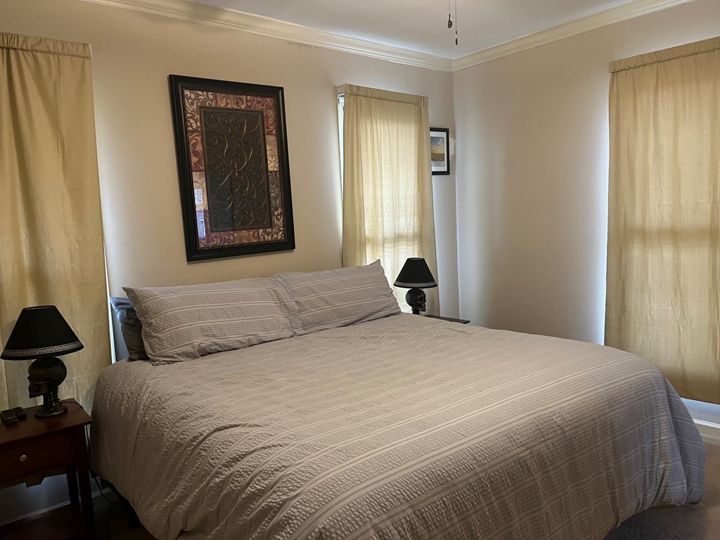 2250 15th Street, Unit 7 Columbus, GA 31906 - Photo 14 of 14 a bedroom with a bed and a window