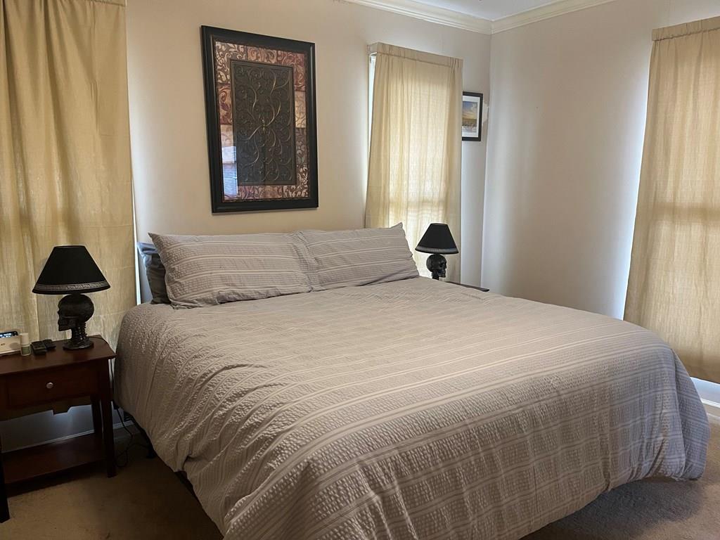 2250 15th Street, Unit 7 Columbus, GA 31906 - Photo 4 of 14 a bedroom with a bed and a window