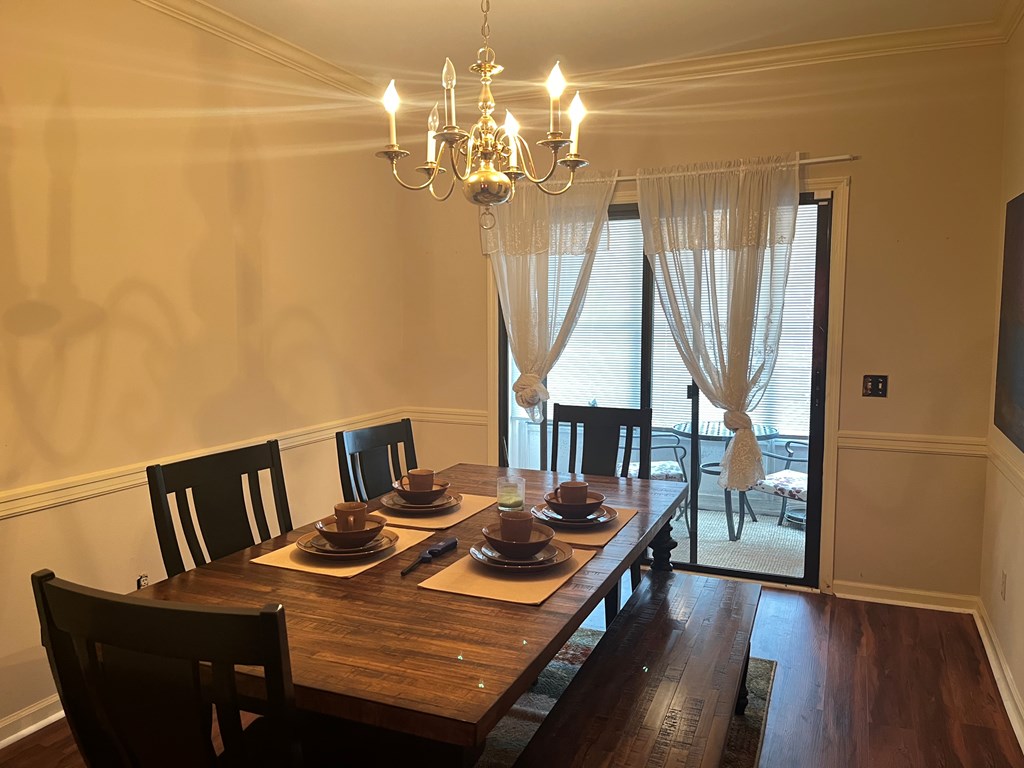 2250 15th Street, Unit 7 Columbus, GA 31906 - Photo 5 of 14 a view of a dining room with furniture and wooden floor