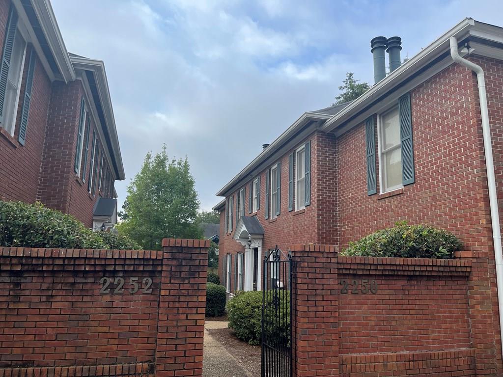 2250 15th Street, Unit 7 Columbus, GA 31906 - Photo 7 of 14 a front view of a house with plants