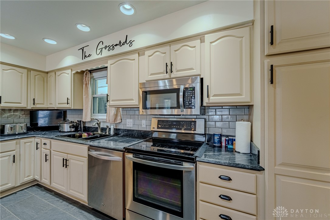 305 South Vandemark Road Sidney, OH 45365 - Photo 18 of 32 This modern kitchen offers stainless steel appliances and abundant cabinetry for stylish, convenient living.