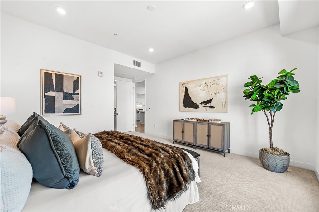 3604 Rivington Irvine, CA 92612 - Photo 27 of 54 a bedroom with a bed and a potted plant