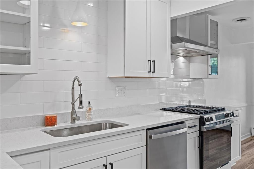 233 Sunset Drive Pittsburgh, PA 15235 - Photo 18 of 48 a kitchen with a sink and cabinets