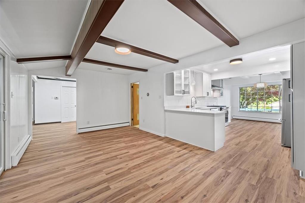 233 Sunset Drive Pittsburgh, PA 15235 - Photo 19 of 48 a view of a kitchen with wooden floor and a sink
