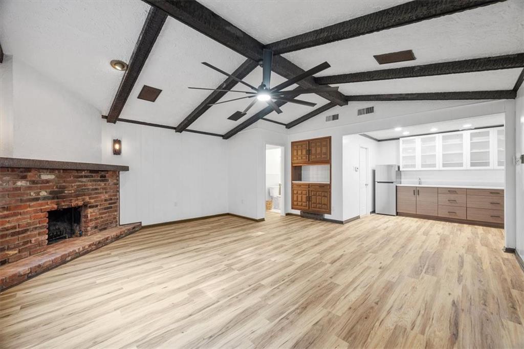 233 Sunset Drive Pittsburgh, PA 15235 - Photo 23 of 48 a view of an empty room with wooden floor fireplace and a window