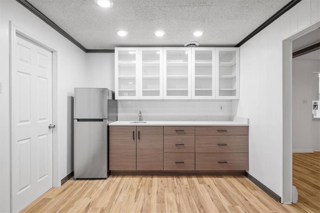 233 Sunset Drive Pittsburgh, PA 15235 - Photo 24 of 48 a kitchen with a refrigerator cabinet and a sink