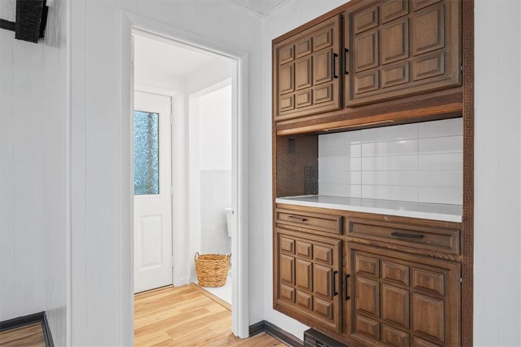 233 Sunset Drive Pittsburgh, PA 15235 - Photo 25 of 48 a view of a kitchen with wooden cabinets