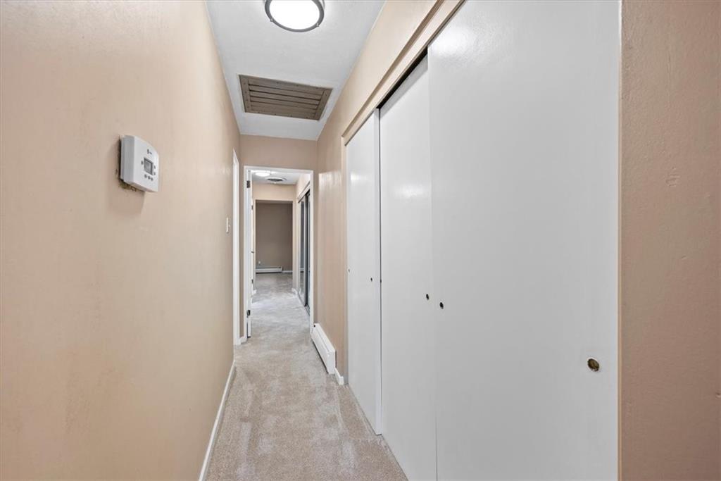 233 Sunset Drive Pittsburgh, PA 15235 - Photo 34 of 48 a view of a hallway with wooden floor and a bathroom