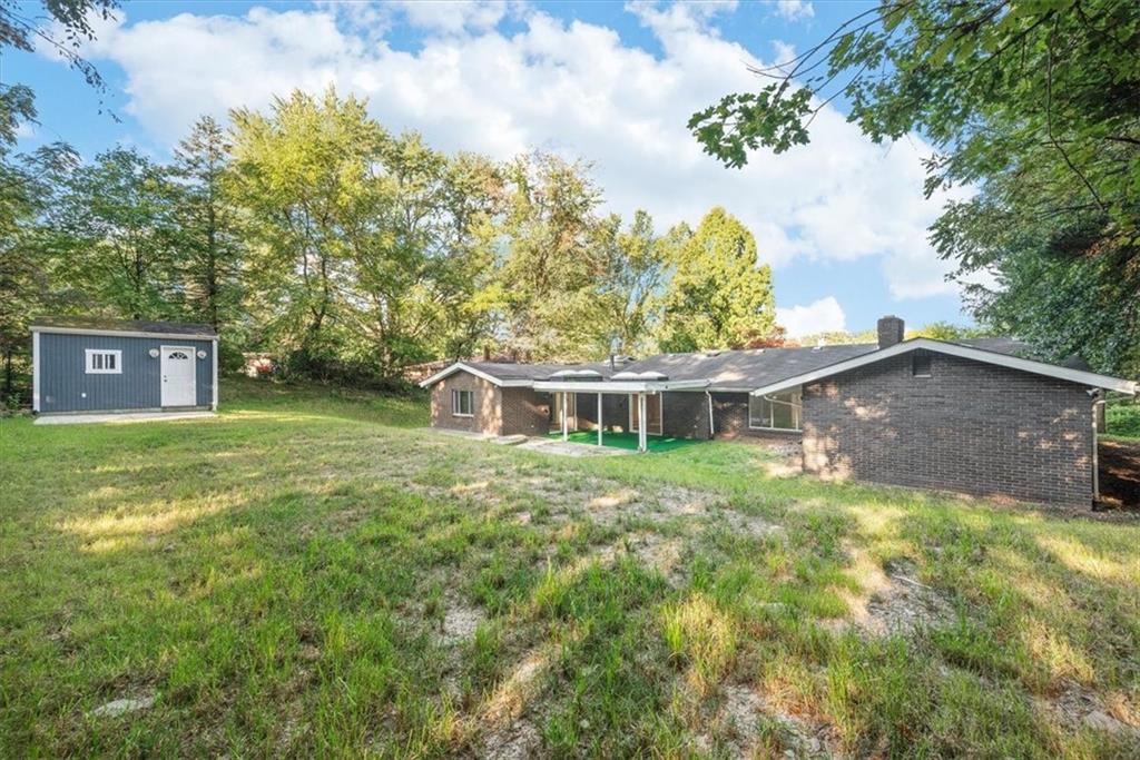 233 Sunset Drive Pittsburgh, PA 15235 - Photo 44 of 48 a front view of a house with a garden