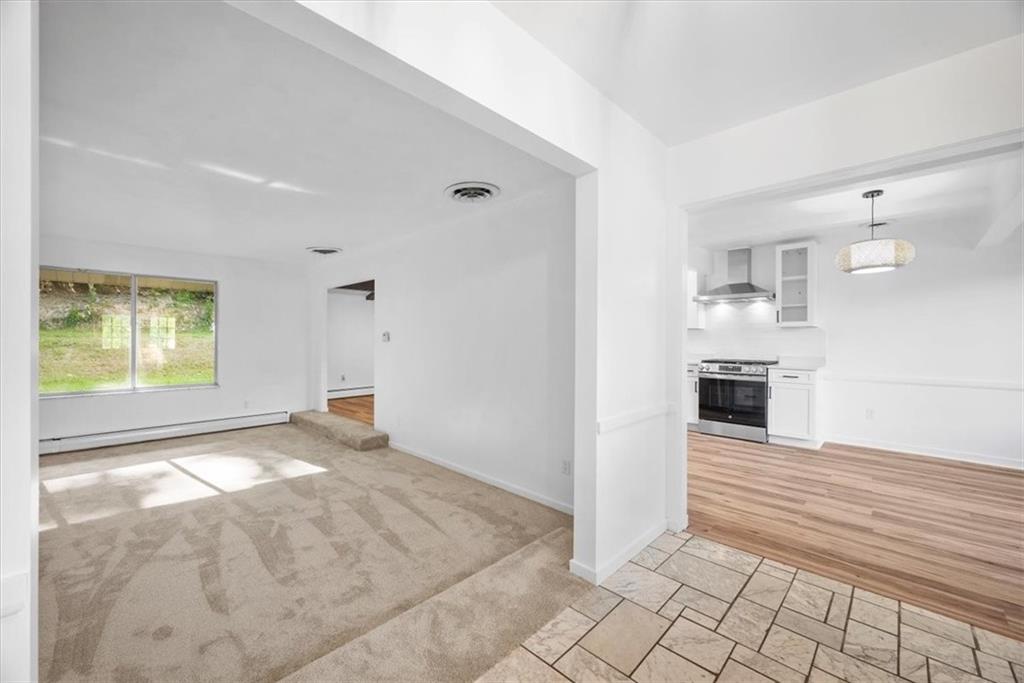 233 Sunset Drive Pittsburgh, PA 15235 - Photo 7 of 48 a view of a kitchen with furniture and an empty room