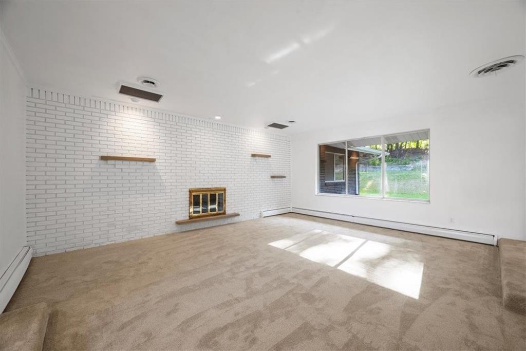 233 Sunset Drive Pittsburgh, PA 15235 - Photo 9 of 48 a view of a livingroom with a staircase