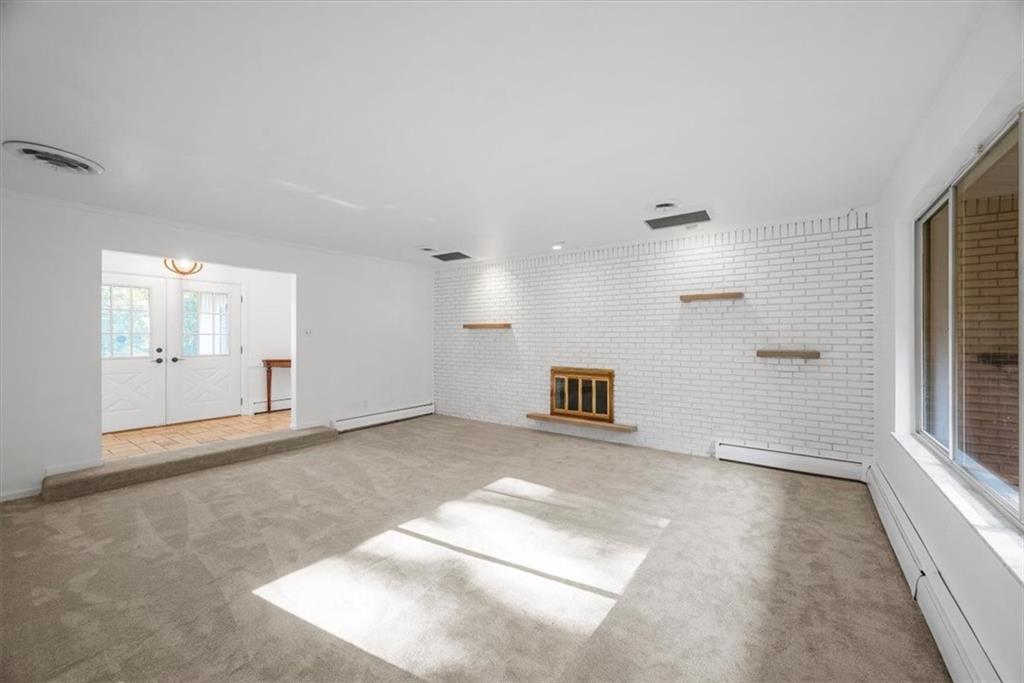 233 Sunset Drive Pittsburgh, PA 15235 - Photo 10 of 48 wooden floor in an empty room with a window