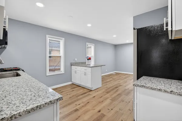 a kitchen with a stove and a sink