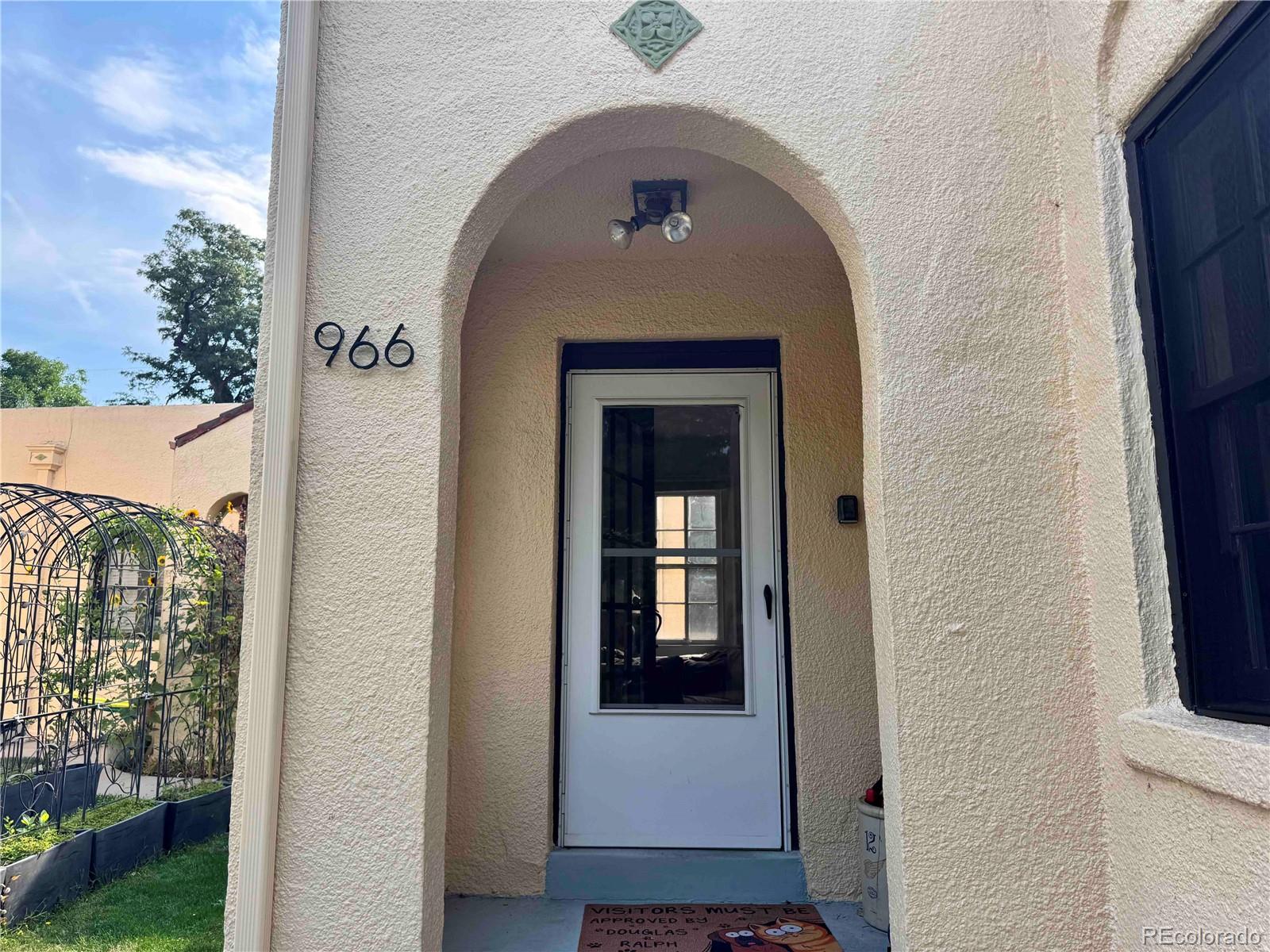 966 Garfield Street Denver, CO 80206 - Photo 1 of 27 a view of a entryway door of the house