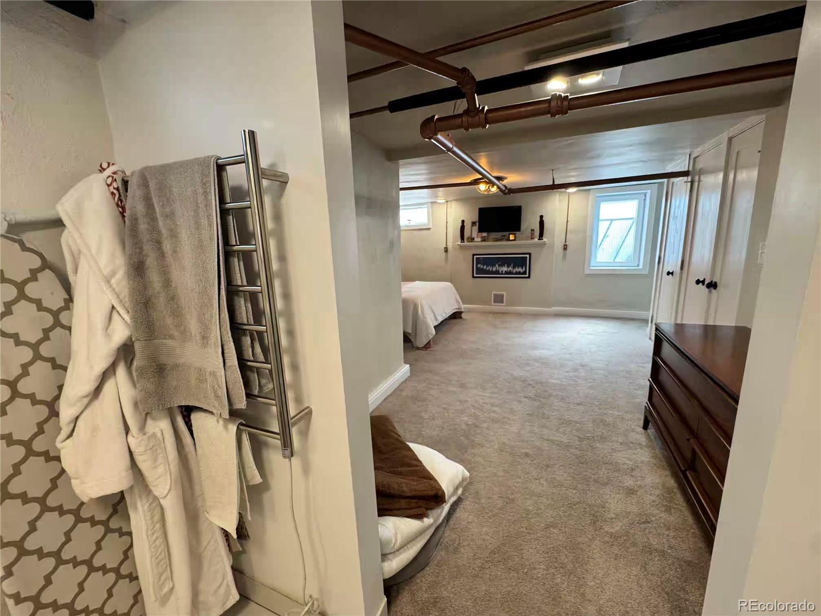 966 Garfield Street Denver, CO 80206 - Photo 21 of 27 a view of a living room with furniture and a window