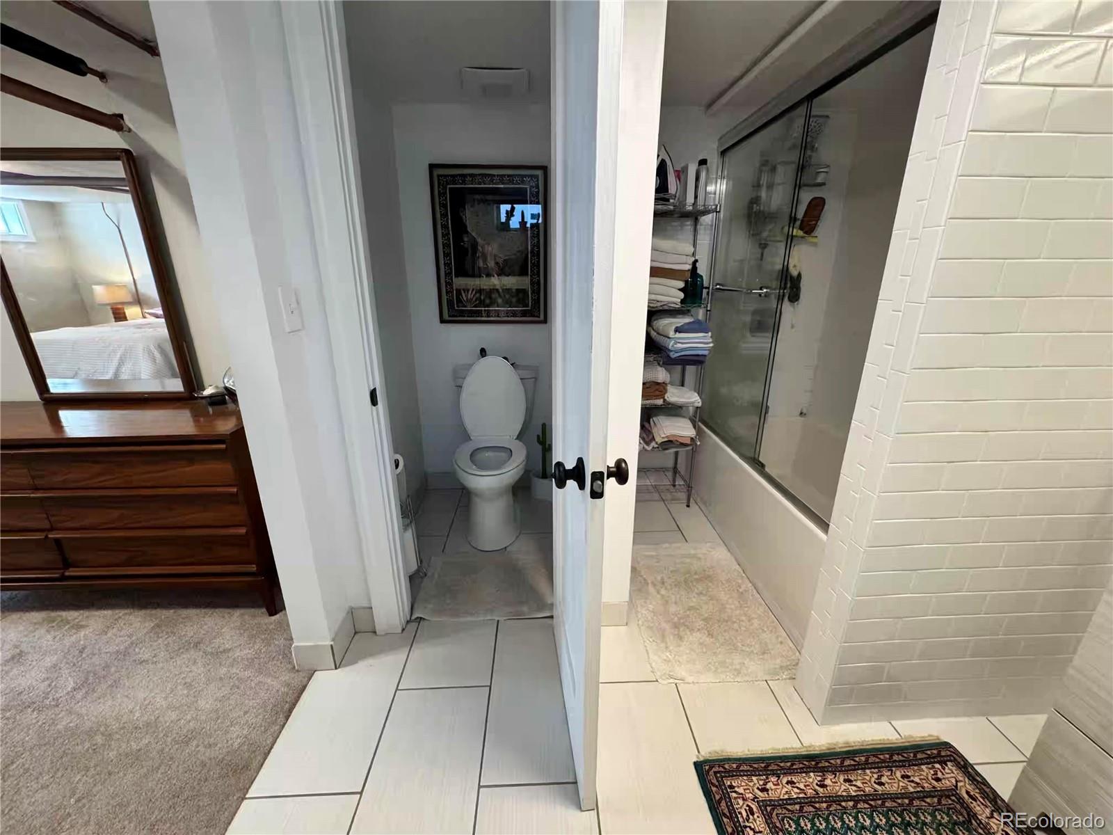 966 Garfield Street Denver, CO 80206 - Photo 24 of 27 a view of a hallway with wooden floor and stairs