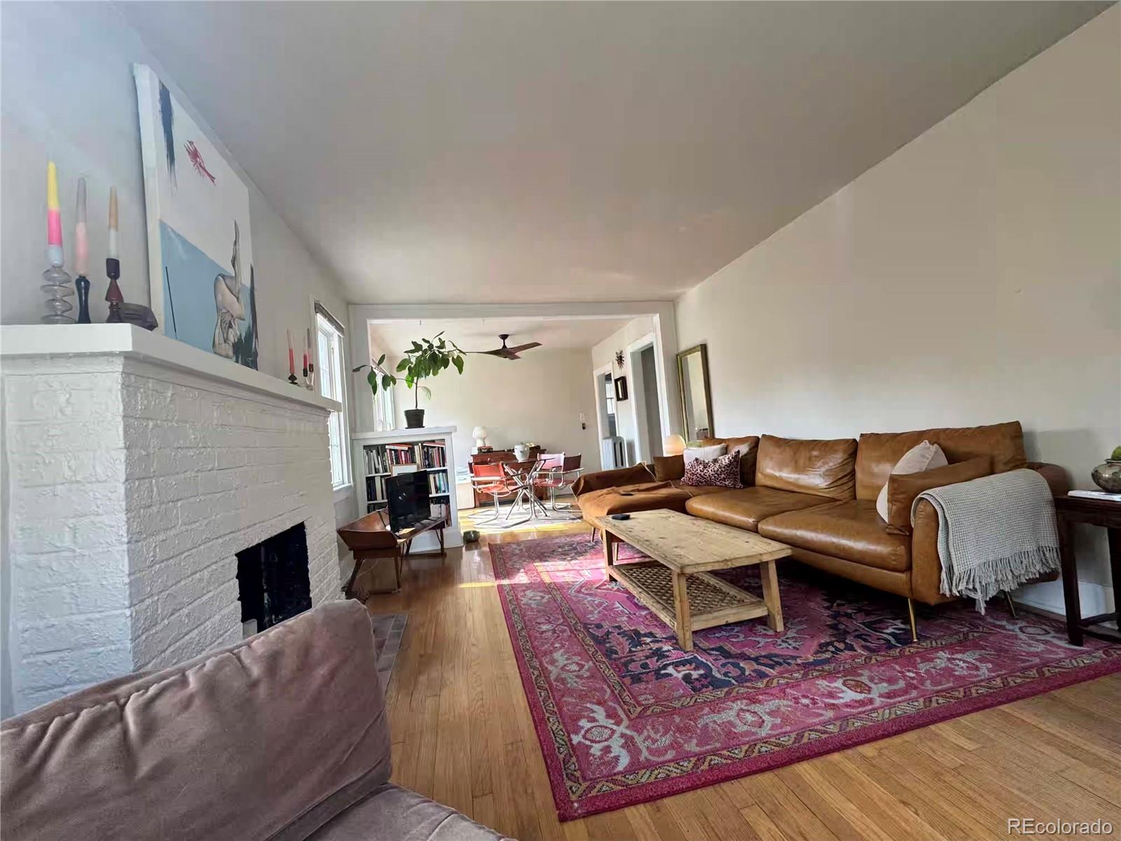 966 Garfield Street Denver, CO 80206 - Photo 3 of 27 a living room with furniture and a fireplace