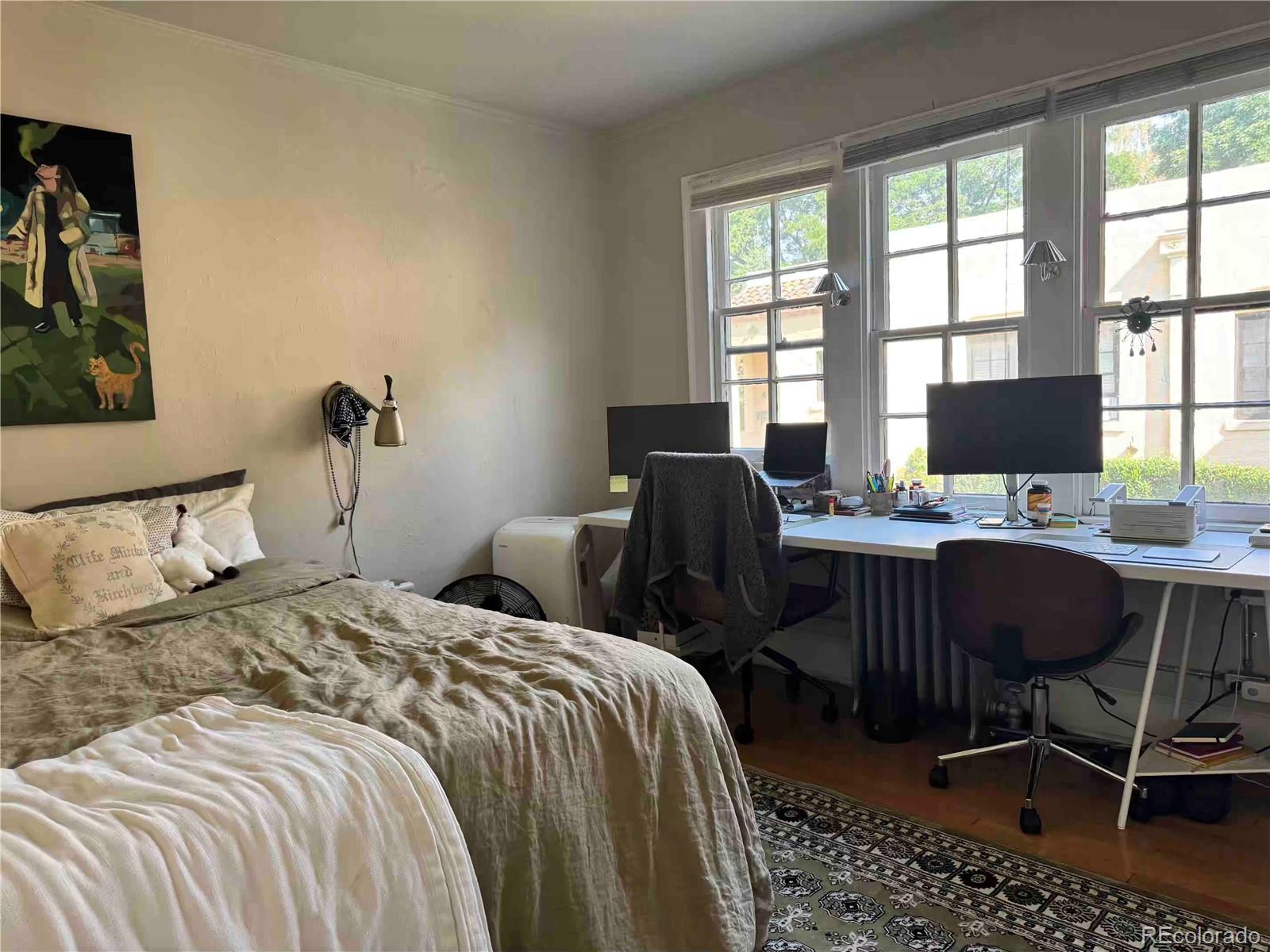 966 Garfield Street Denver, CO 80206 - Photo 8 of 27 a bedroom with two beds and a desk