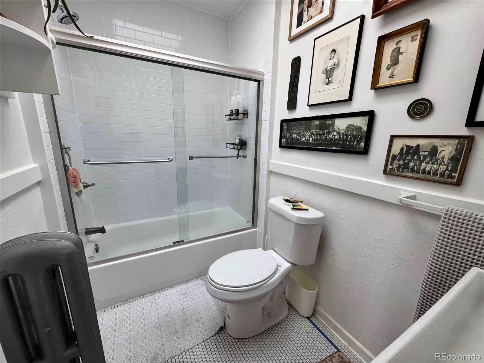 966 Garfield Street Denver, CO 80206 - Photo 9 of 27 a bathroom with a toilet and a shower