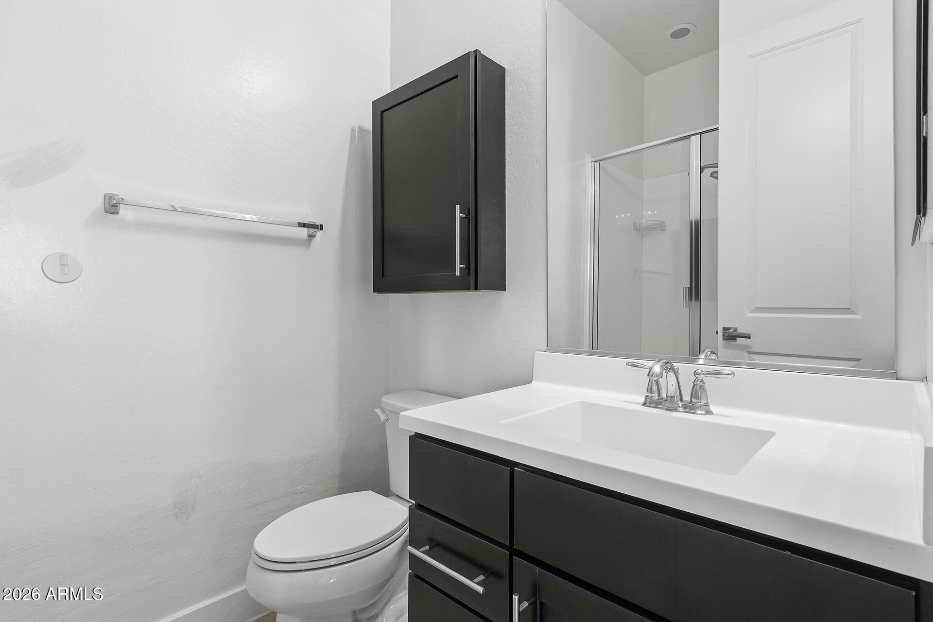 12035 West Roy Rogers Road Peoria, AZ 85383 - Photo 17 of 46 a bathroom with a sink a toilet a shower and a mirror