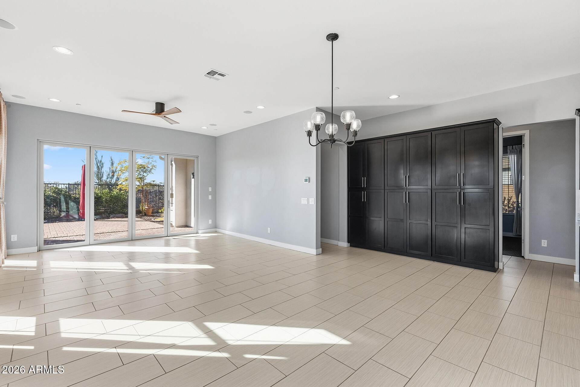 12035 West Roy Rogers Road Peoria, AZ 85383 - Photo 24 of 46 a view of an empty room with a chandelier